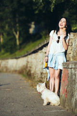 Girl with ice cream and dog