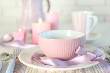 Beautiful holiday table setting in pink color