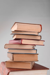Heap of books on grey background