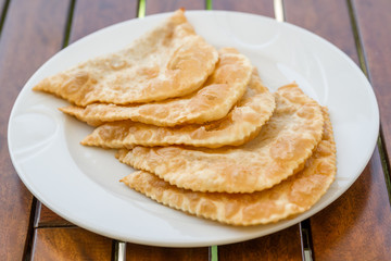 Cig Borek, Famous Turkish Meat Pie, ciborek on White Plate