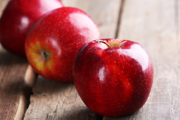 Ripe red apples on table close up
