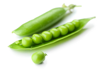 Fresh green peas isolated on white