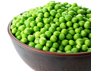 Fresh green peas in bowl isolated on white