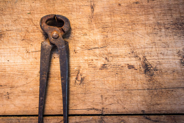 Color photo of vintage wrench on the wooden grunge table with copy space