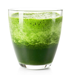 Glass of green vegetable juice isolated on white