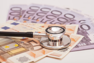 Euro banknotes and stethoscope