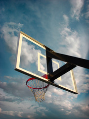 basketball hoop with cloudy sky