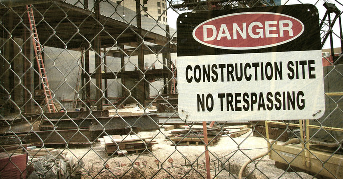 aged and worn vintage photo of danger construction site sign