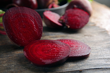 Young beets on wooden table close up