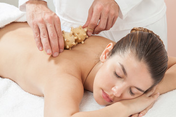 Obraz na płótnie Canvas Woman getting a massage with a special tool
