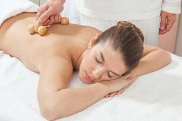 Woman lying gets great massage