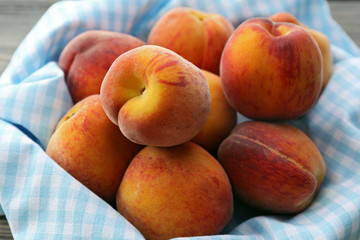 Sweet ripe peaches on table close up