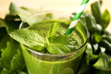 Green healthy juice with herbs close up