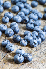 Fresh blueberries on old wooden background selective focus