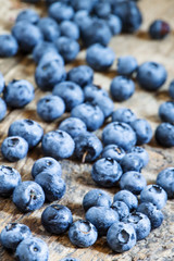 Fresh blueberries on old wooden background selective focus