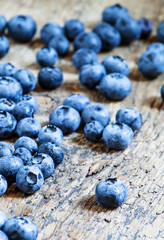 Fresh blueberries on old wooden background selective focus