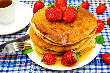 pancakes with strawberries and tea