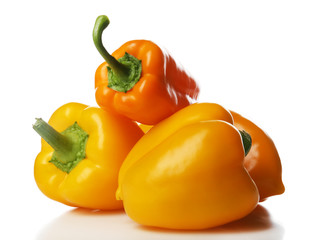 Group of yellow peppers isolated on white