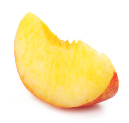 Piece of peach isolated on white