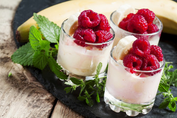 Ice cream with banana and raspberry, selective focus