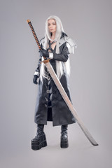 Fantasy woman warrior / Woman warrior with sword and armor isolated on the gray background