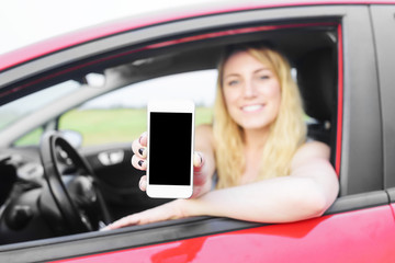 Driver woman showing her smartphone.