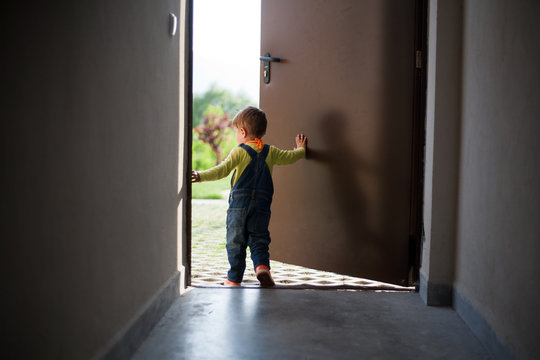 Little Boy Opens Door