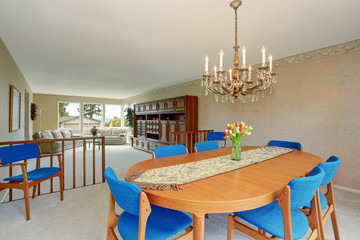 Modern dinning room with royal blue chairs.