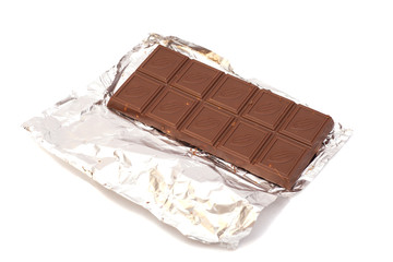 Chocolate bar in foil isolated on white background