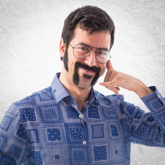 Vintage young man making phone gesture