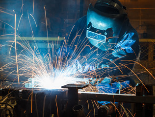 Industrial steel welder in factory