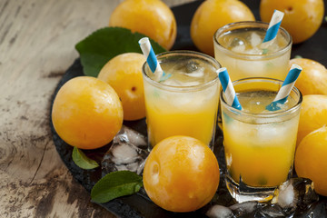 Plum smoothie with ice and straws striped, selective focus