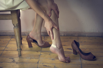 Closeup of a woman's heel with a blister plaster on