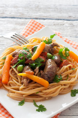 Fried chicken hearts , pasta and vegetables
