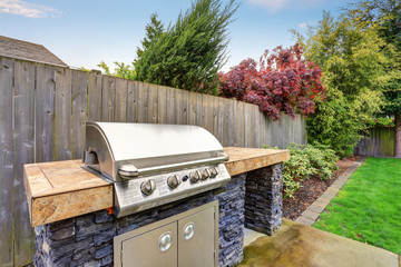 Back yard with nice grill station.