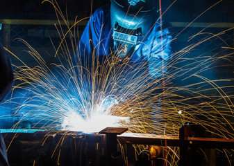 people welding industry