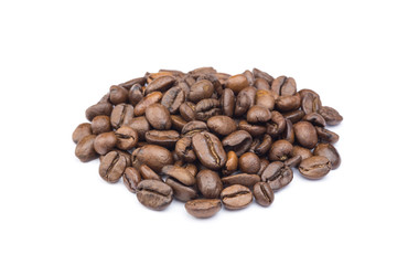 Heap of whole coffee beans isolated on white background