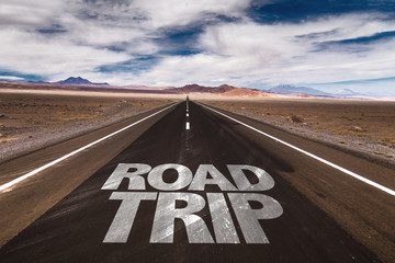 Road Trip written on desert road
