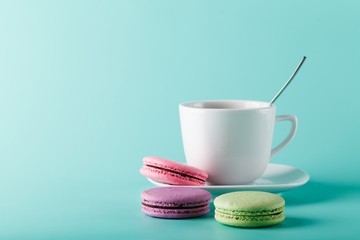 Coffee cup on aqua background with place for an inscription