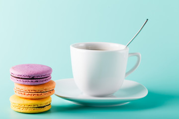 Coffee cup on aqua background with place for an inscription
