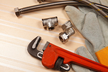 Set of plumbing and tools on the table