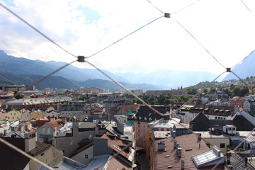 Aerial view of Innsbruck city taken from City Tower (Stadtturm) which was built in 1450 in Tirol, Austria. With 51 meters of height, City Tower is located in Old City (Altstadt or Altestadt).