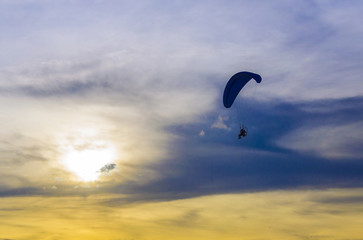 paramotor in sunset sky