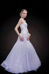 Portrait of Caucasian Bride Posing in Gorgeous Wedding Dress Mad