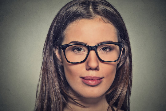 Attractive young woman with brown eyes in glasses