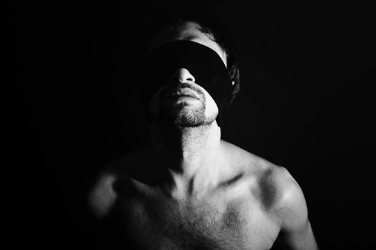 Portrait of nude young men blindfolded