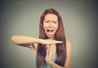 woman showing time out hand gesture, frustrated screaming