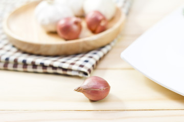Fototapeta na wymiar Fresh Onions on wooden background