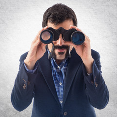 Vintage young man with binoculars