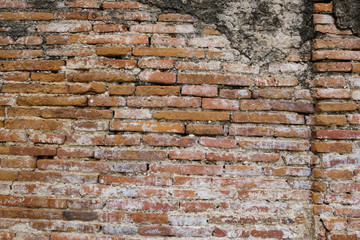 Old red brick wall in Wat Yai Chaimongkol in the Ayutthaya Historical Park, Ayutthaya, Thailand
